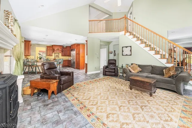 a room with pool table and windows