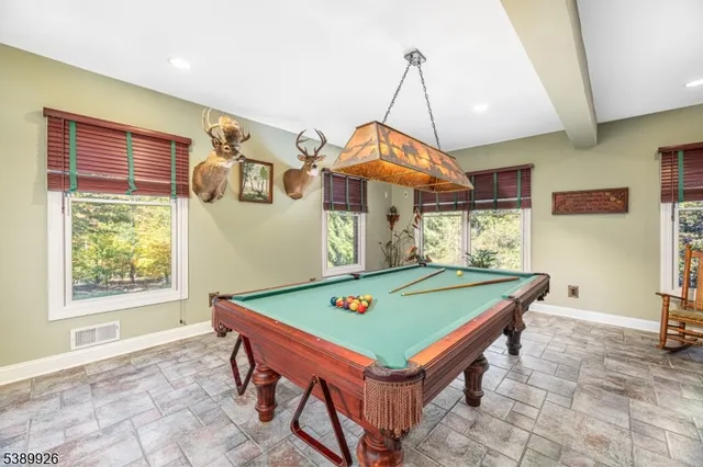a dining room with furniture and window