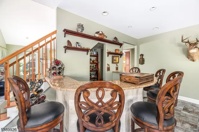 a bathroom with a sink vanity mirror and toilet