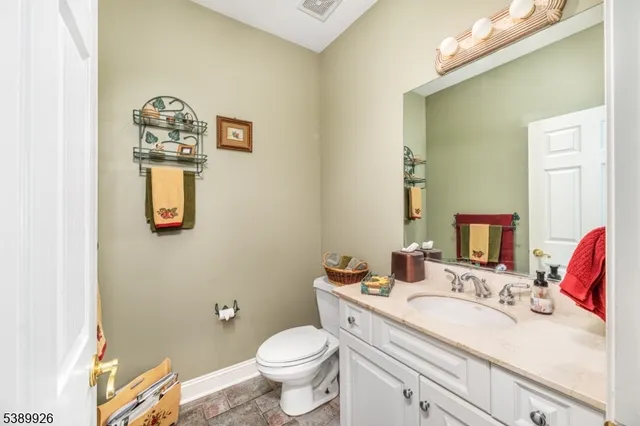 a living room with furniture a rug and a floor to ceiling window