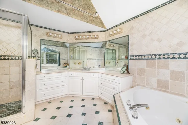 a view of a room with wooden floor and furniture