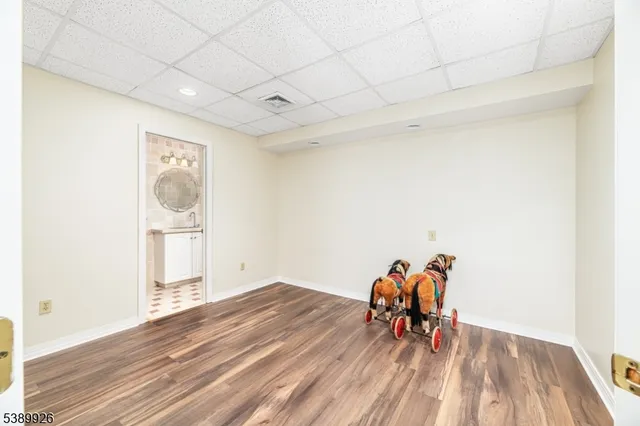 an empty room with furniture and window