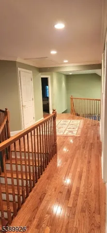 a bathroom with a granite countertop sink a mirror and a bathtub