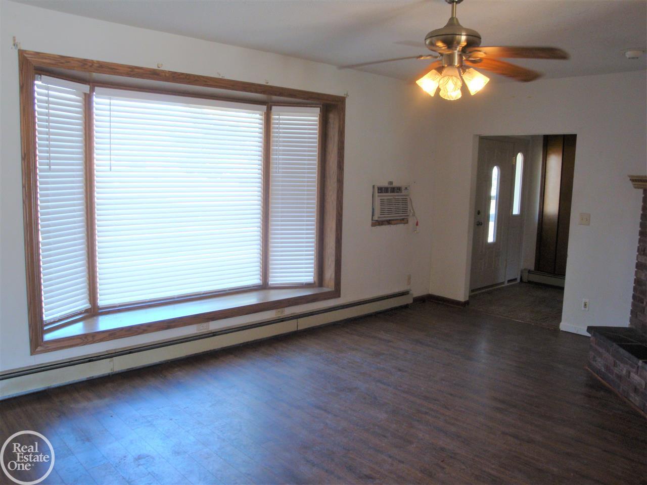 48814 Callens Road New Baltimore, MI 48047 - Photo 3 of 32 Living Room w/ Bay Window