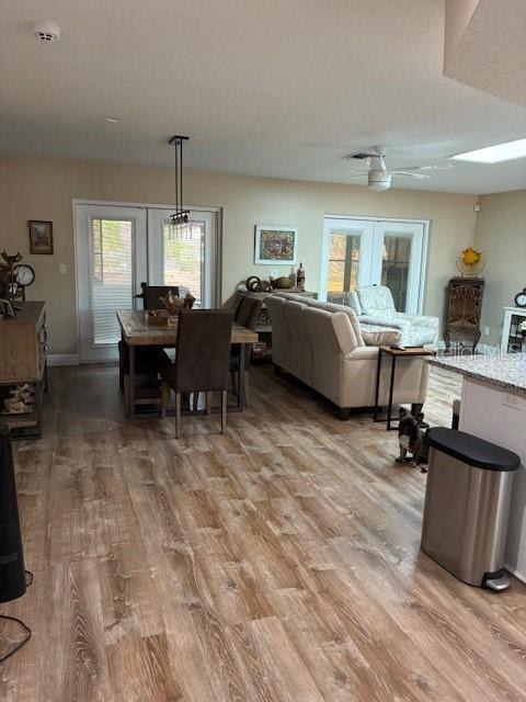 7421 Glasgow Road Weeki Wachee, FL 34613 - Photo 6 of 11 a living room with furniture and a wooden floor