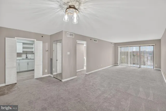 a view of an empty room with a window