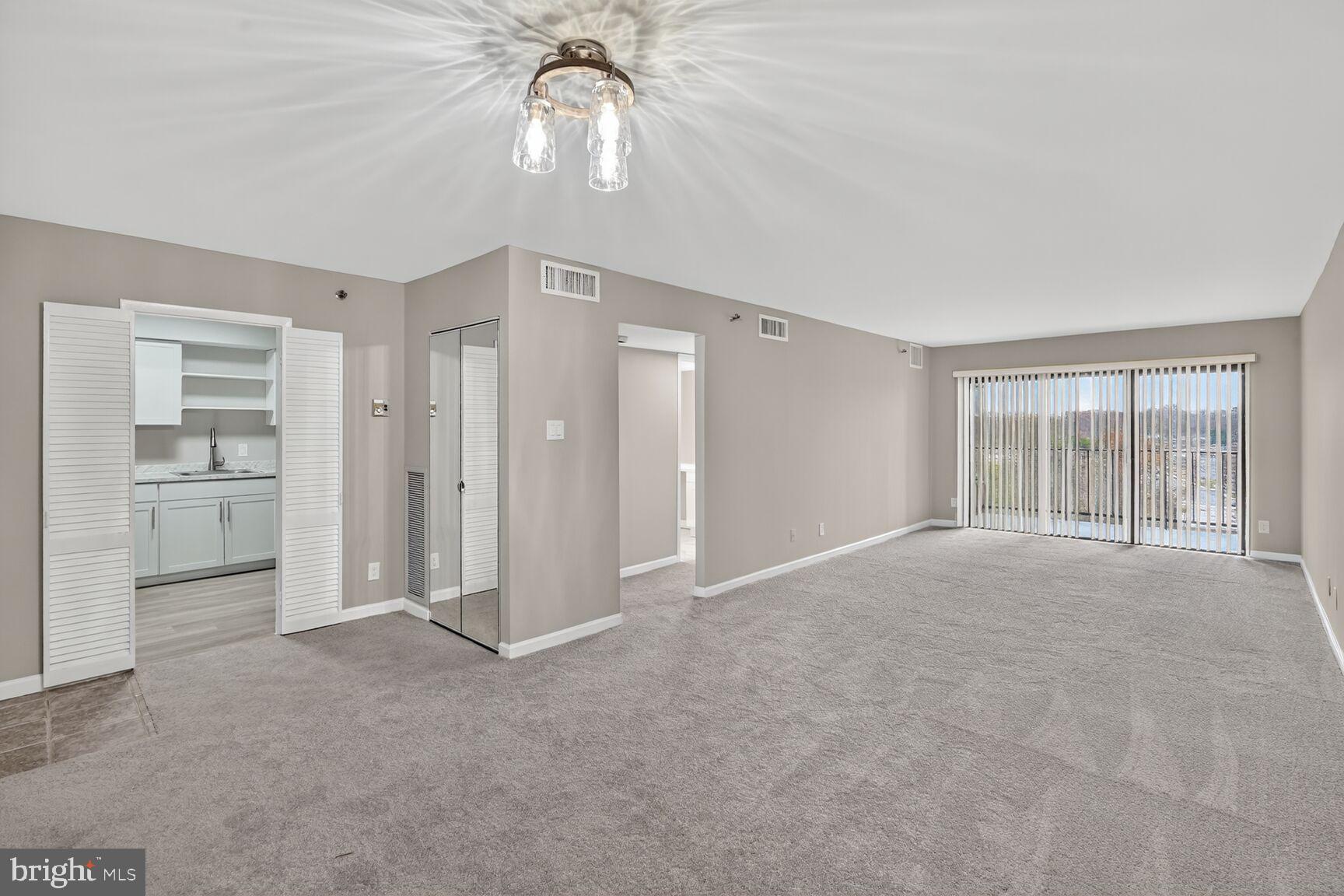 9200 Edwards Way, Unit 811 Hyattsville, MD 20783 - Photo 2 of 15 a view of an empty room with a window