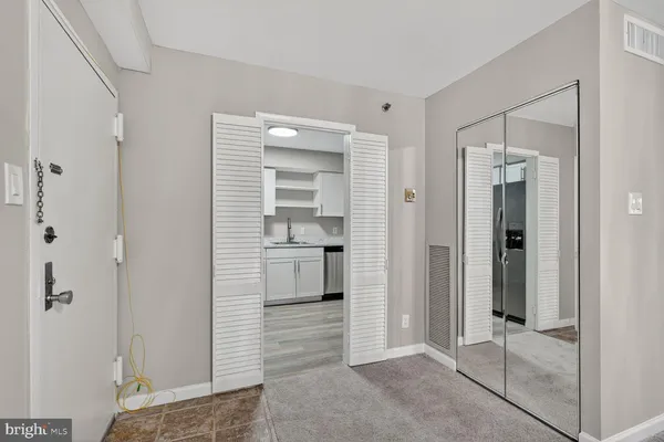 a view of a bathroom with a shower and a sink