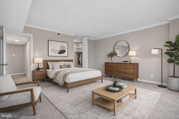 a bedroom with bed and a couch