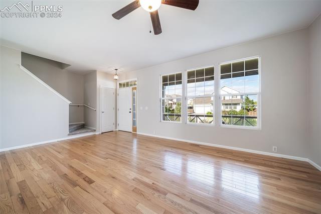 9356 Bethpage Road Peyton, CO 80831 - Photo 8 of 40 Spare room with ceiling fan and light hardwood / wood-style flooring