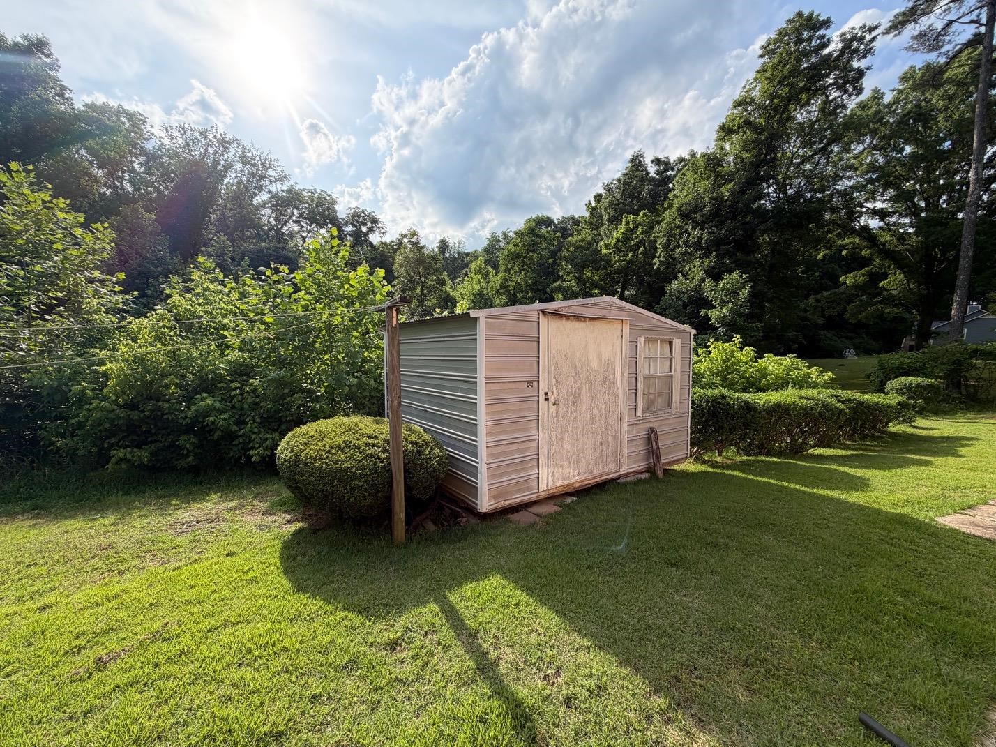 321 Pipkin Road Jackson, TN 38305 - Photo 14 of 16 a view of a backyard with swimming pool