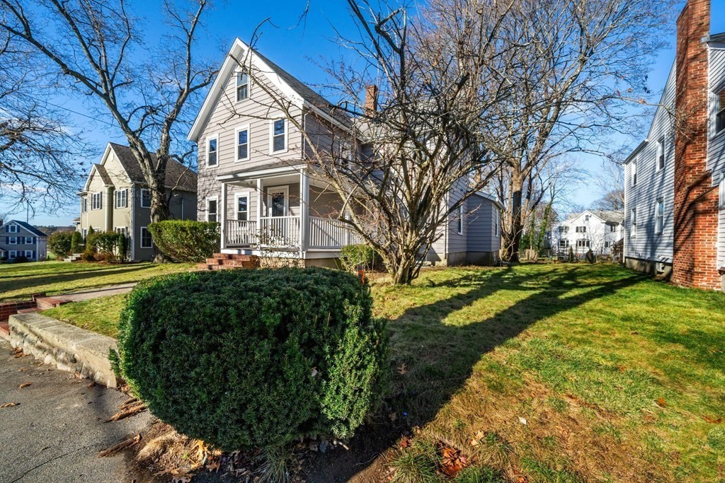 a front view of a house with a yard