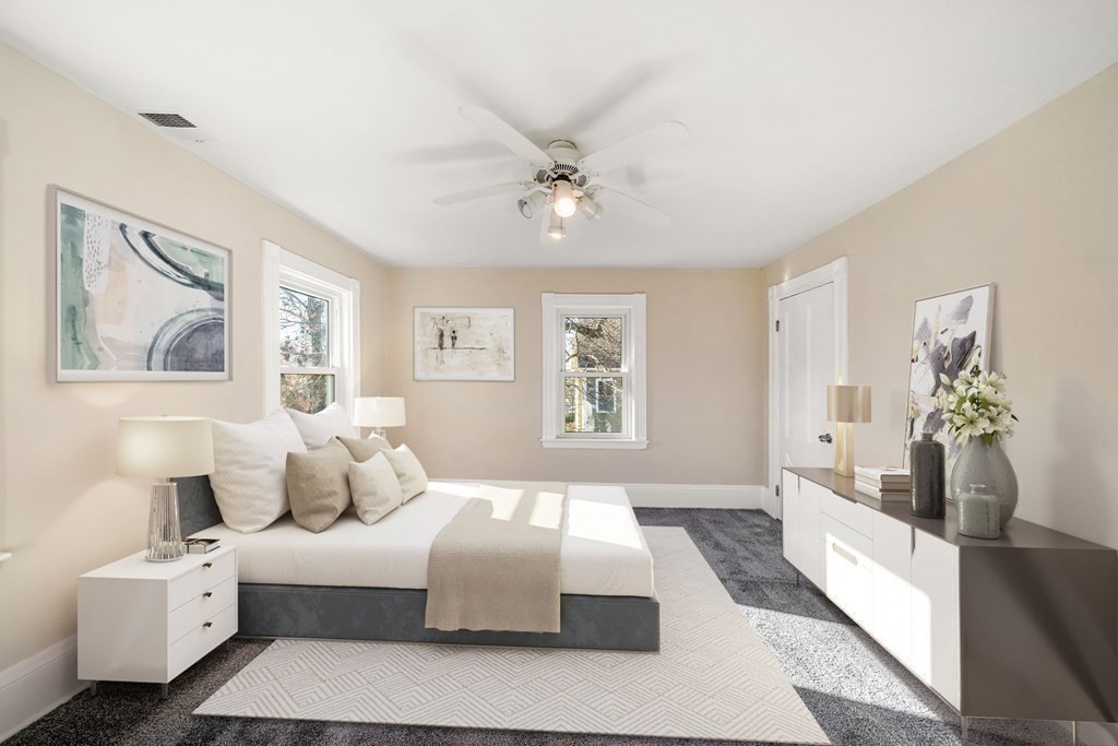 85 Barrows Street Dedham, MA 02026 - Photo 14 of 31 a bedroom with a large bed and a couch