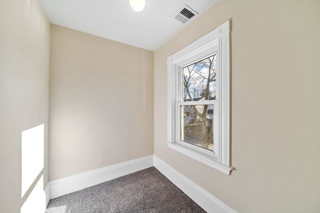 85 Barrows Street Dedham, MA 02026 - Photo 17 of 31 a view of an empty room with a window