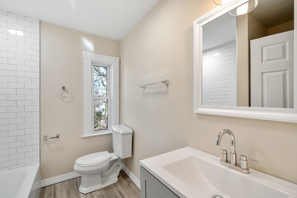 85 Barrows Street Dedham, MA 02026 - Photo 18 of 31 a bathroom with a sink toilet and mirror