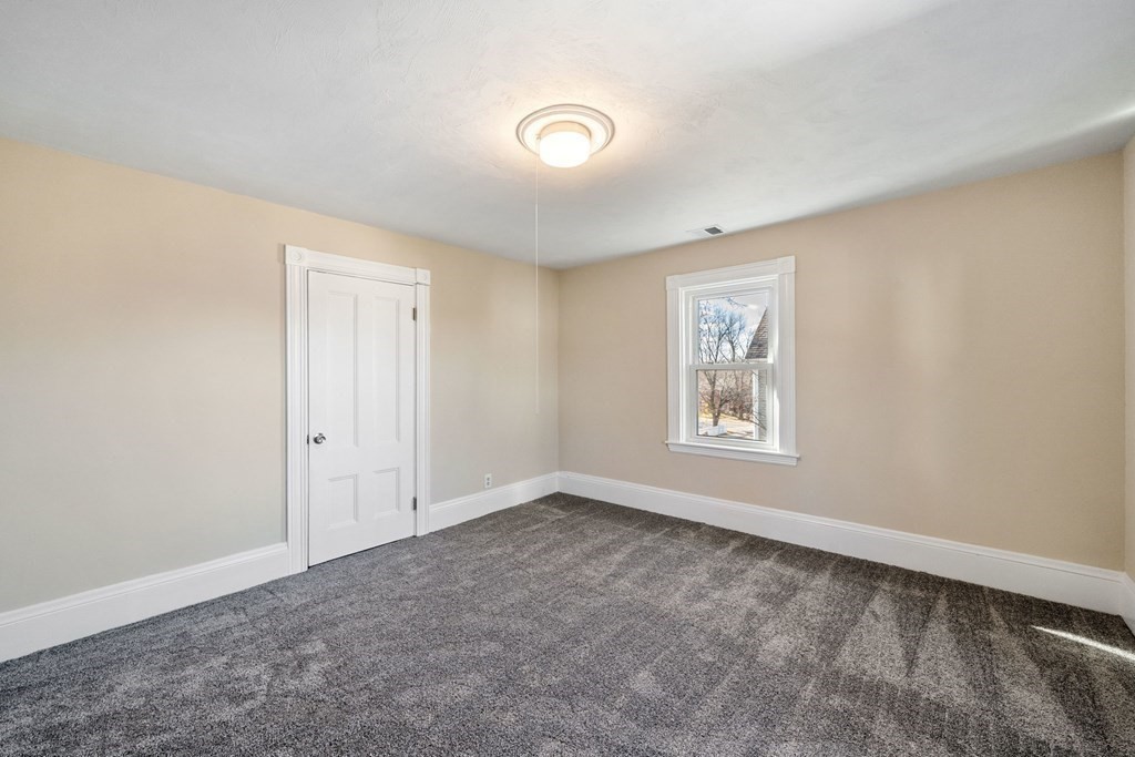 85 Barrows Street Dedham, MA 02026 - Photo 22 of 31 a view of an empty room with a window