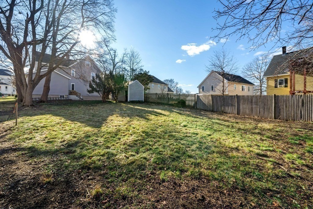 85 Barrows Street Dedham, MA 02026 - Photo 26 of 31 a view of a yard with large tree