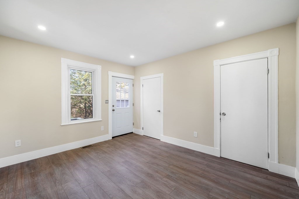 85 Barrows Street Dedham, MA 02026 - Photo 10 of 31 an empty room with wooden floor and windows