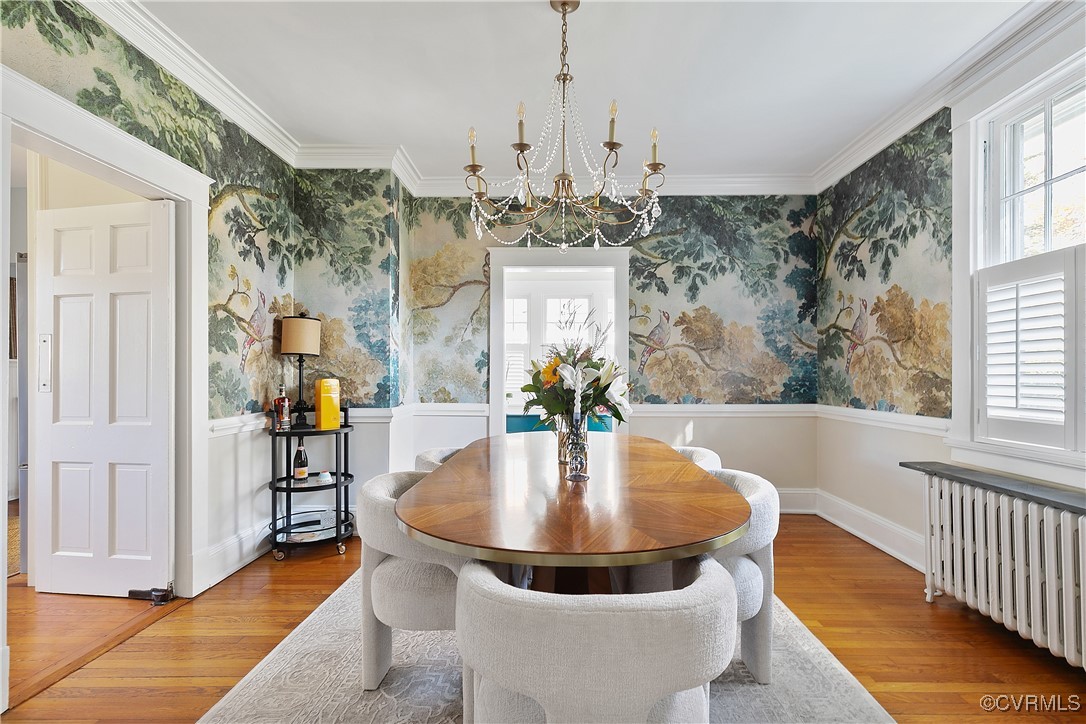 4222 Seminary Avenue Richmond, VA 23227 - Photo 18 of 50 a dining room with chandelier and wooden floor
