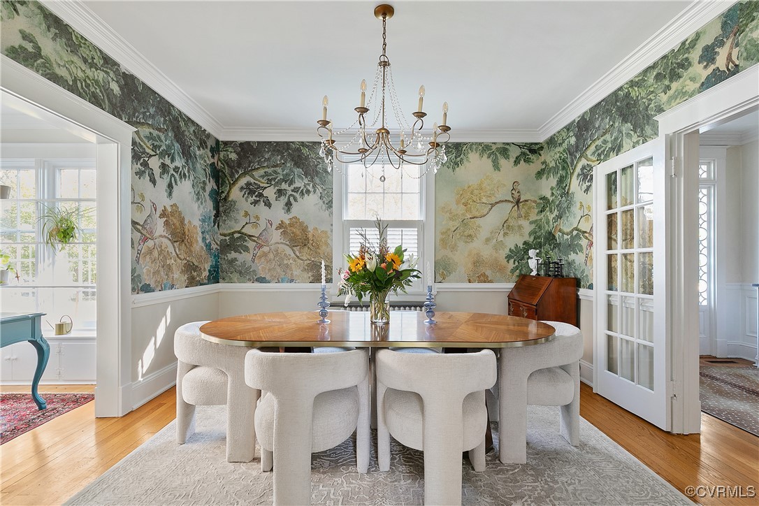 4222 Seminary Avenue Richmond, VA 23227 - Photo 19 of 50 a dining room with furniture a chandelier and wooden floor