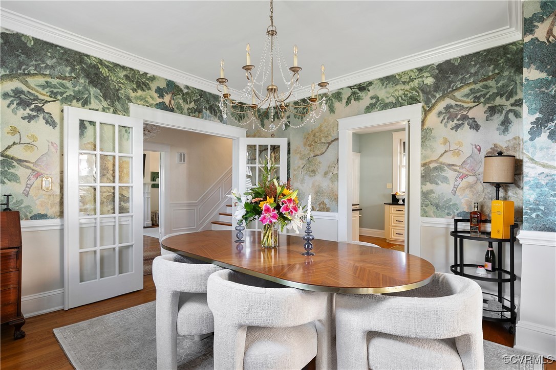 4222 Seminary Avenue Richmond, VA 23227 - Photo 20 of 50 a dining room with furniture a chandelier and wooden floor