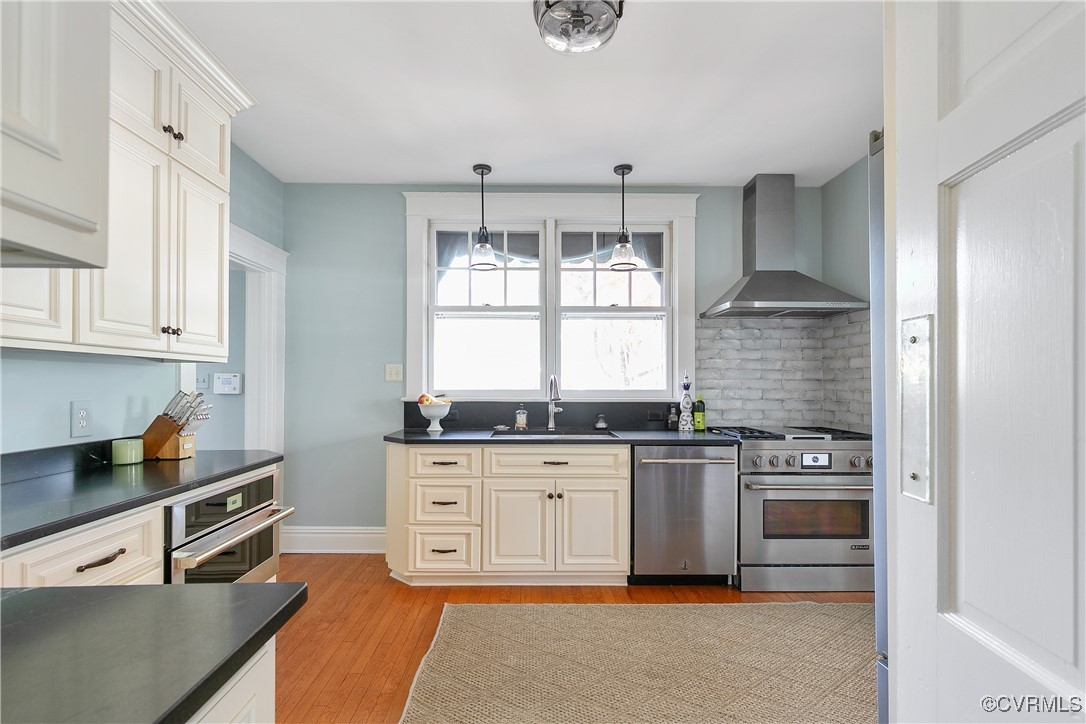 4222 Seminary Avenue Richmond, VA 23227 - Photo 23 of 50 a kitchen with stainless steel appliances granite countertop a stove a sink and a refrigerator