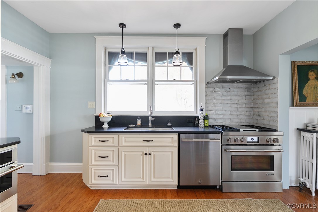 4222 Seminary Avenue Richmond, VA 23227 - Photo 24 of 50 a kitchen with stainless steel appliances granite countertop a stove and a wooden cabinets