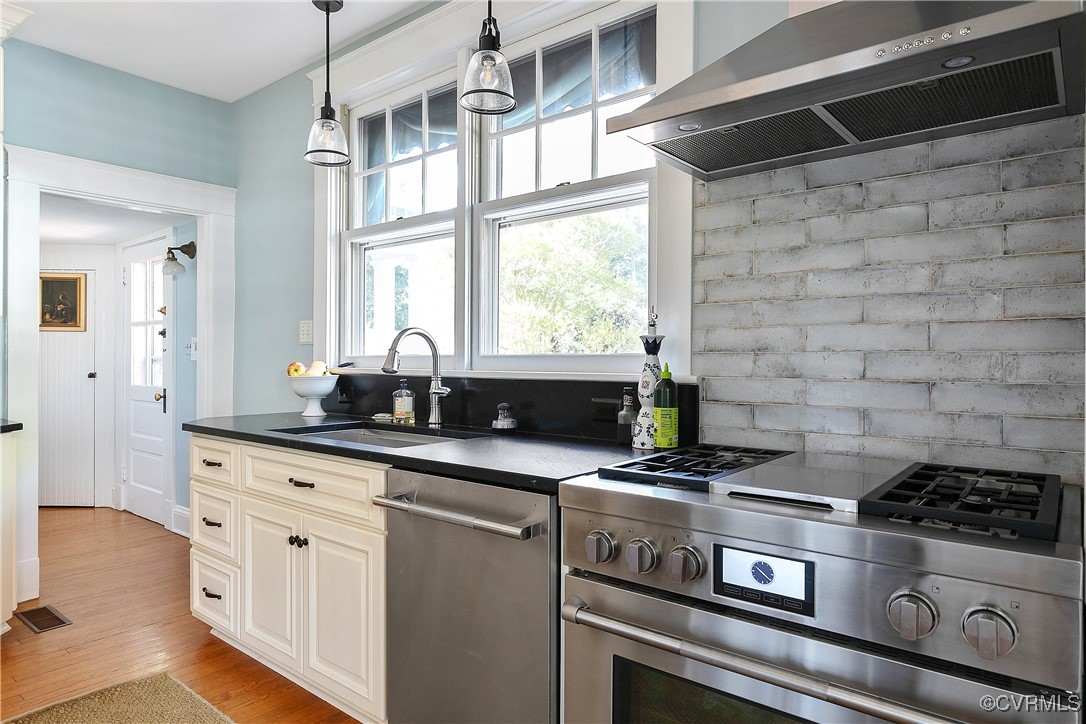 4222 Seminary Avenue Richmond, VA 23227 - Photo 26 of 50 a kitchen with granite countertop a stove and a sink