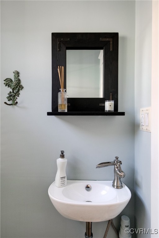 4222 Seminary Avenue Richmond, VA 23227 - Photo 30 of 50 a bathroom with a sink and a mirror