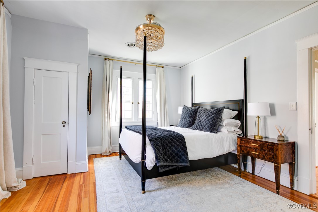 4222 Seminary Avenue Richmond, VA 23227 - Photo 34 of 50 a spacious bedroom with a bed and wooden floor