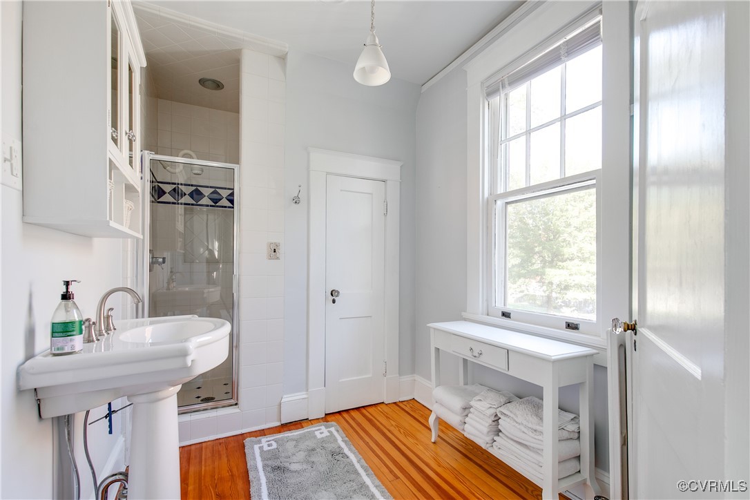 4222 Seminary Avenue Richmond, VA 23227 - Photo 36 of 50 a bathroom with a sink a toilet and a window