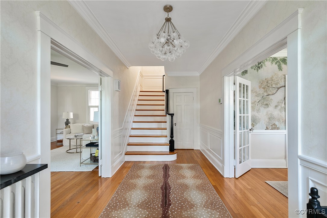 4222 Seminary Avenue Richmond, VA 23227 - Photo 7 of 50 a view of a hallway with wooden floor and windows