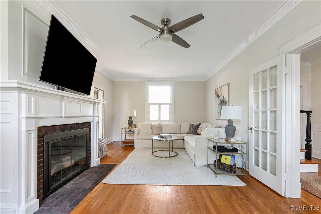 4222 Seminary Avenue Richmond, VA 23227 - Photo 9 of 50 a living room with furniture a fireplace and a flat screen tv