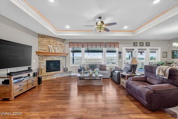 a living room with furniture fireplace and flat screen tv