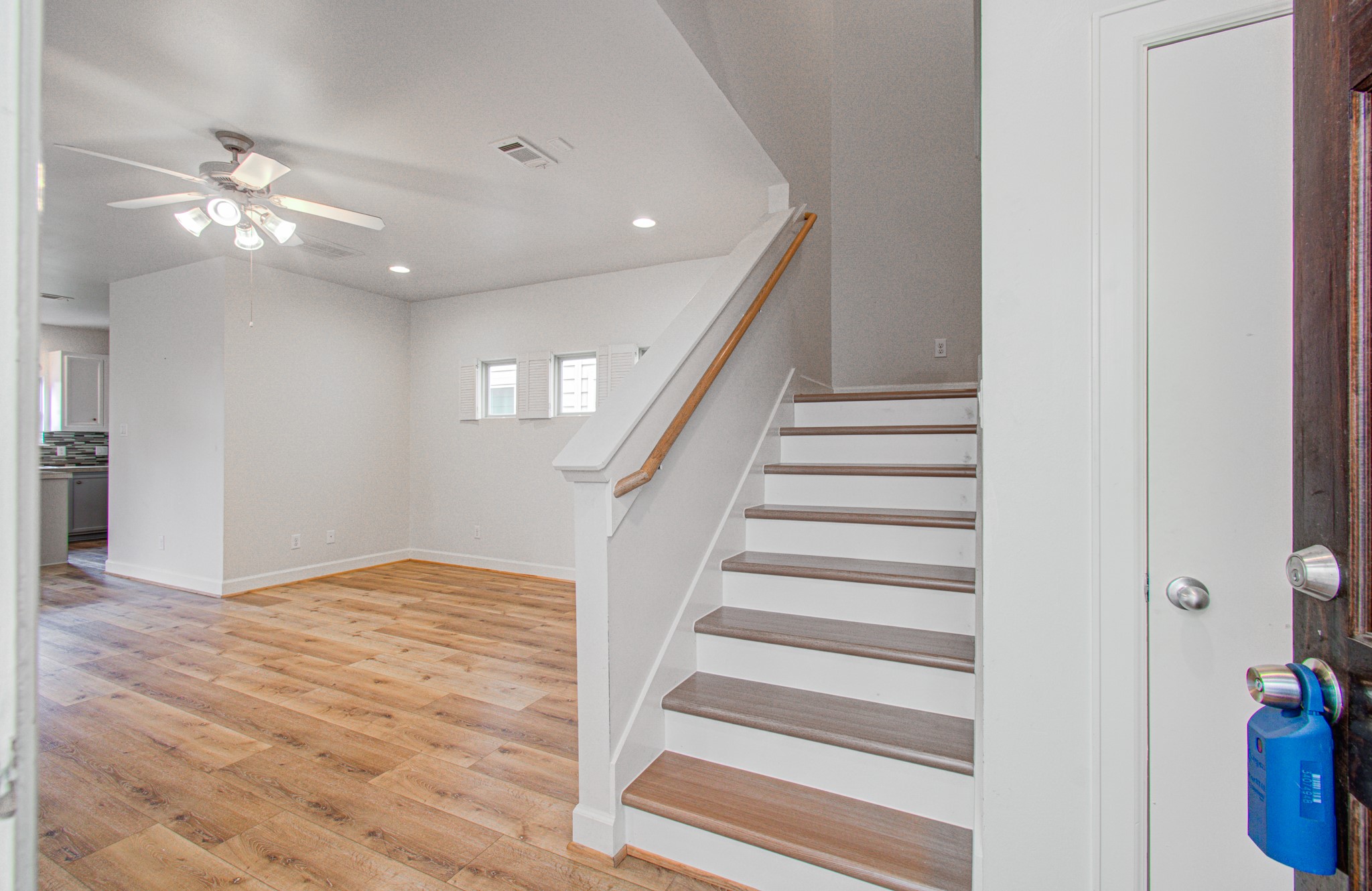 624 East 39th Street Houston, TX 77022 - Photo 7 of 37 a view of an empty room with wooden floor and stairs