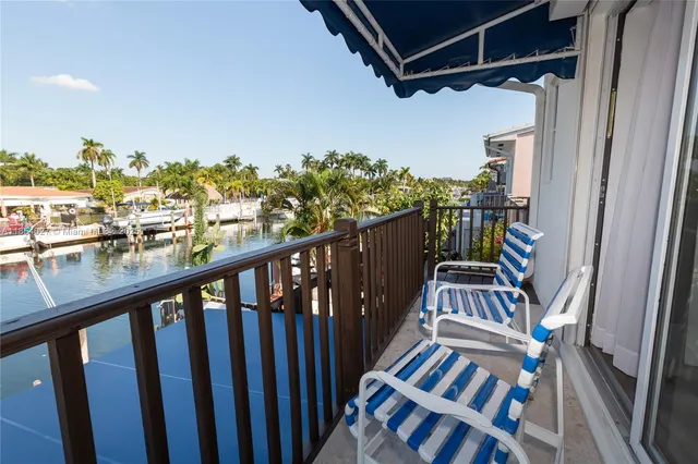 a view of a balcony with wooden floor