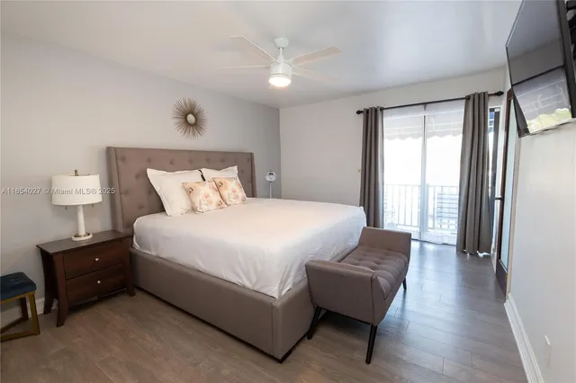 a spacious bedroom with a bed and a couch