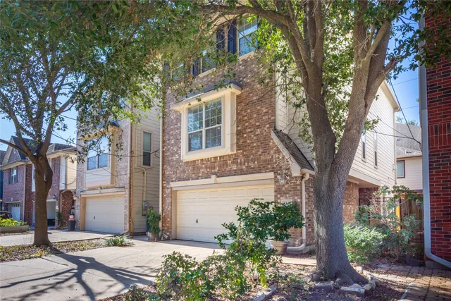 a pathway of a house with a yard
