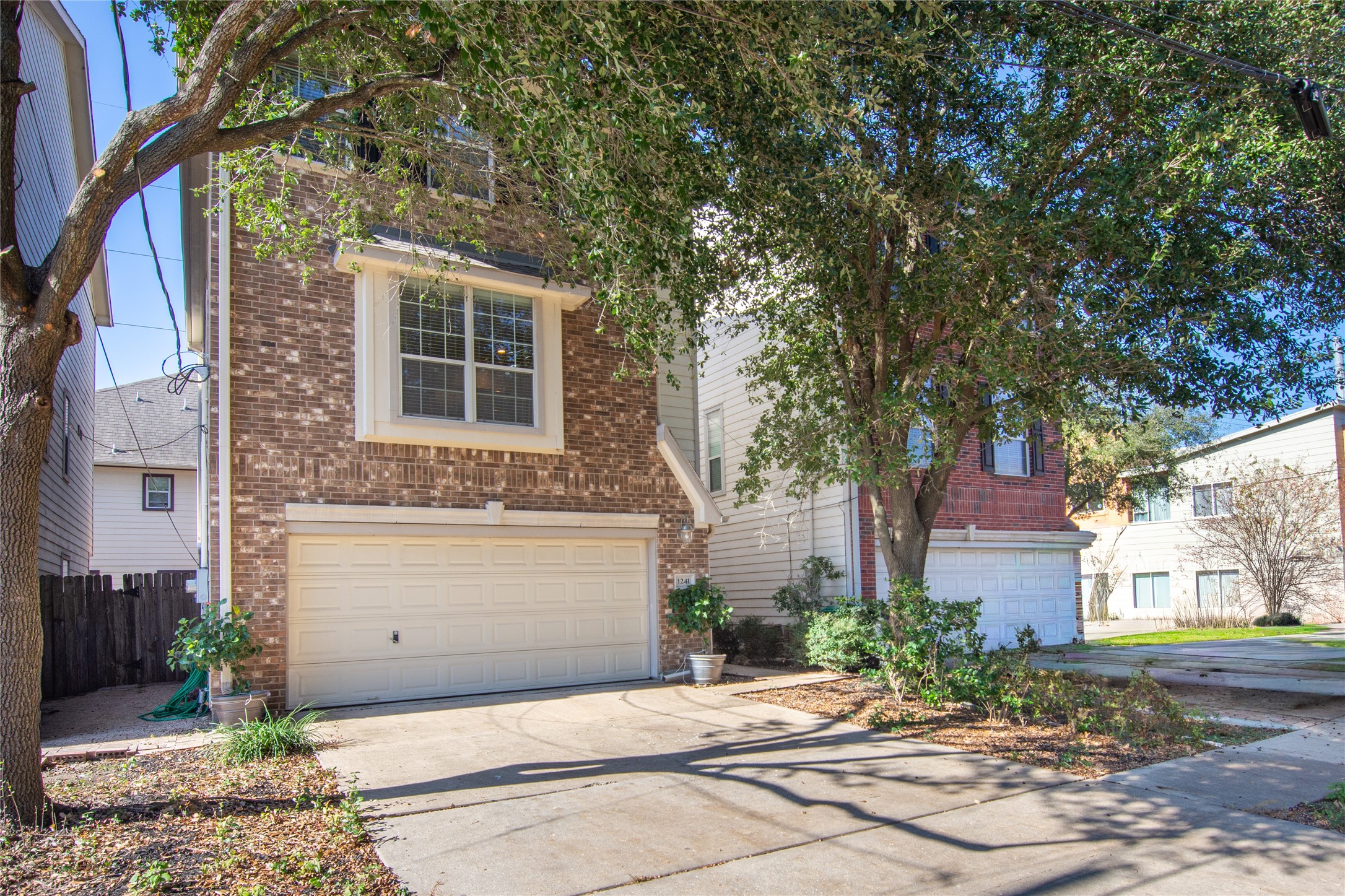 1241 Prince Street Houston, TX 77008 - Photo 2 of 45 a front view of a house with a yard and garage