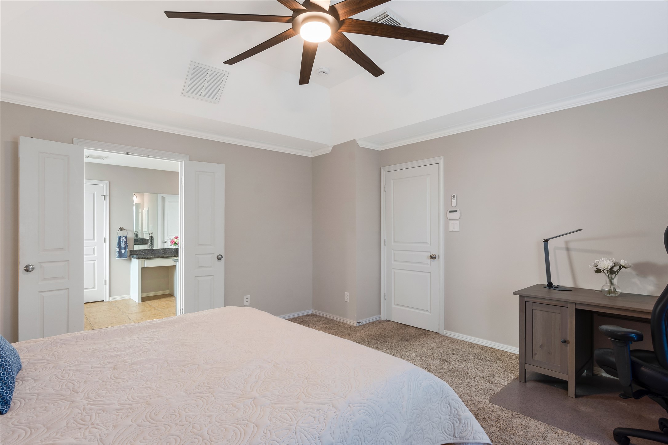 1241 Prince Street Houston, TX 77008 - Photo 34 of 45 a bedroom with a bed and a chandelier