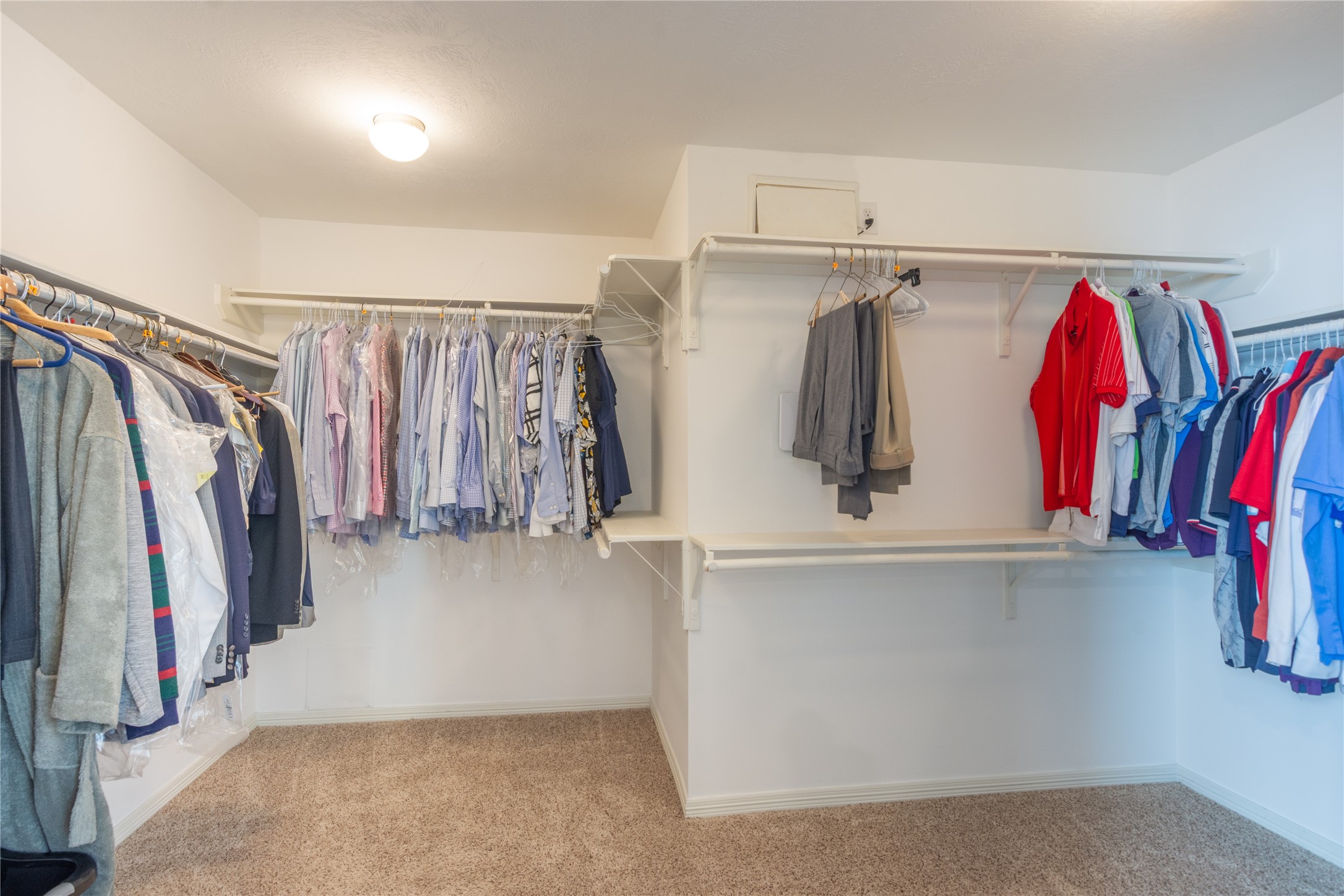 1241 Prince Street Houston, TX 77008 - Photo 38 of 45 a view of walk in closet with clothes