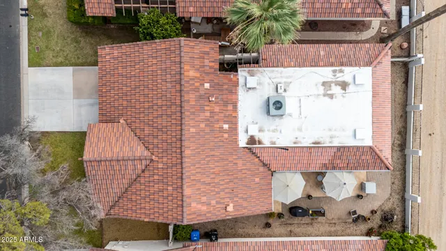 a aerial view of a house with a yard