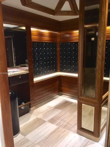 a view of lobby with a door and a rug