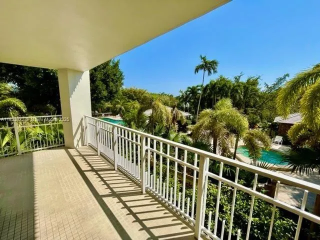 a view of balcony with furniture