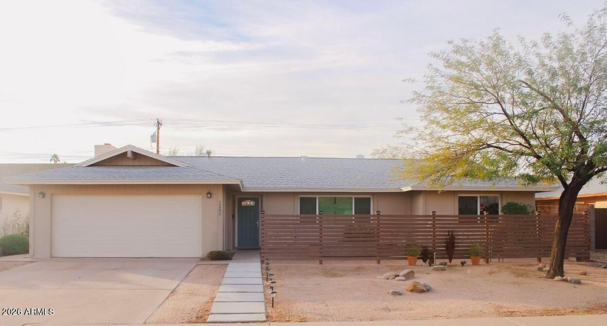 1255 East Riviera Drive Tempe, AZ 85282 - Photo 2 of 15 a front view of a house with a yard