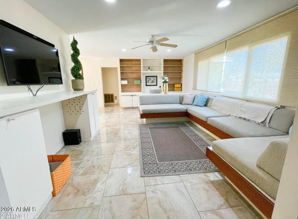 1255 East Riviera Drive Tempe, AZ 85282 - Photo 3 of 15 a living room with furniture and a flat screen tv