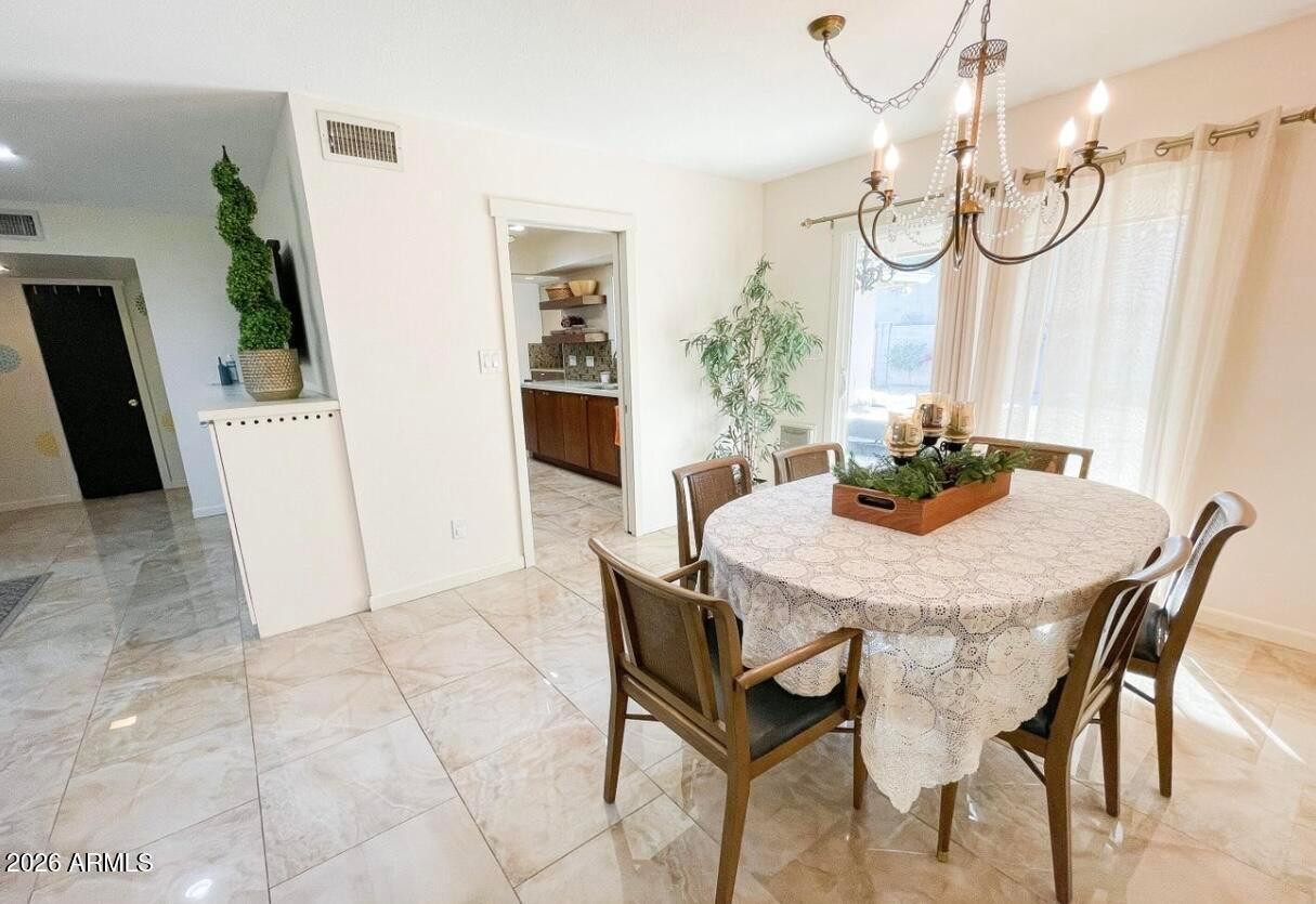 1255 East Riviera Drive Tempe, AZ 85282 - Photo 6 of 15 a dining room with furniture and window