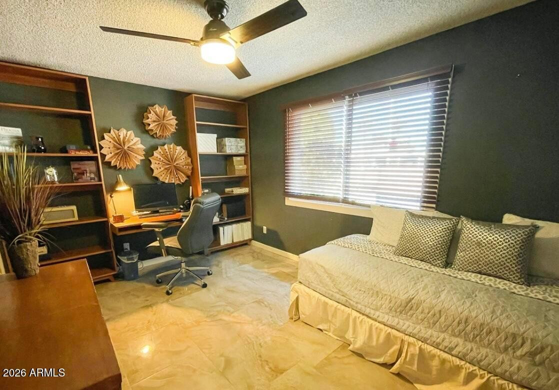 1255 East Riviera Drive Tempe, AZ 85282 - Photo 8 of 15 a bedroom with a bed and wooden floor