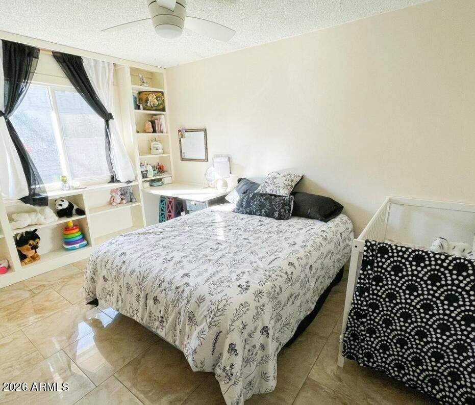 1255 East Riviera Drive Tempe, AZ 85282 - Photo 10 of 15 a bedroom with a bed and a window
