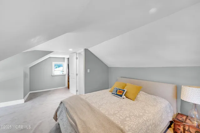 a bedroom with a bed and closet